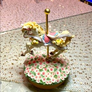 Mini carousel horse with flower bottom. 5x3 1/2 inches